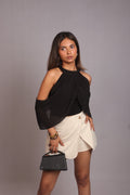 Model wearing the SEANT 002 cold shoulder top in black