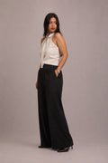 Model wearing the SEANT 006 fluid wide-leg trouser in black
