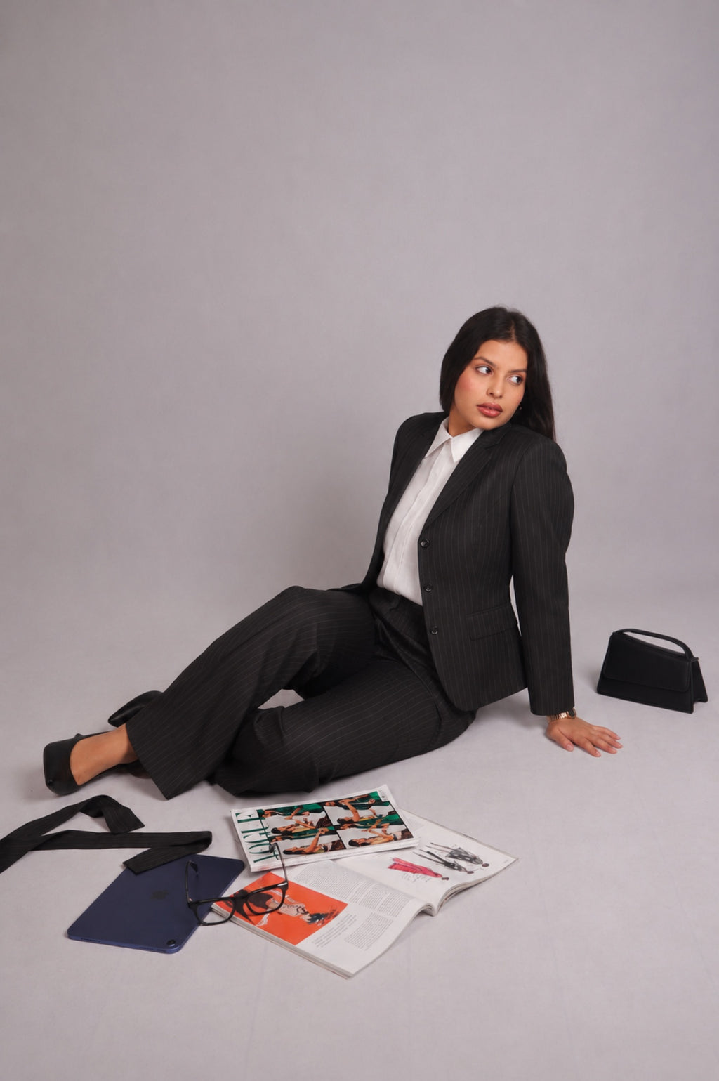 Editorial image of the SEANT 009 pinstripe blazer worn as a suit