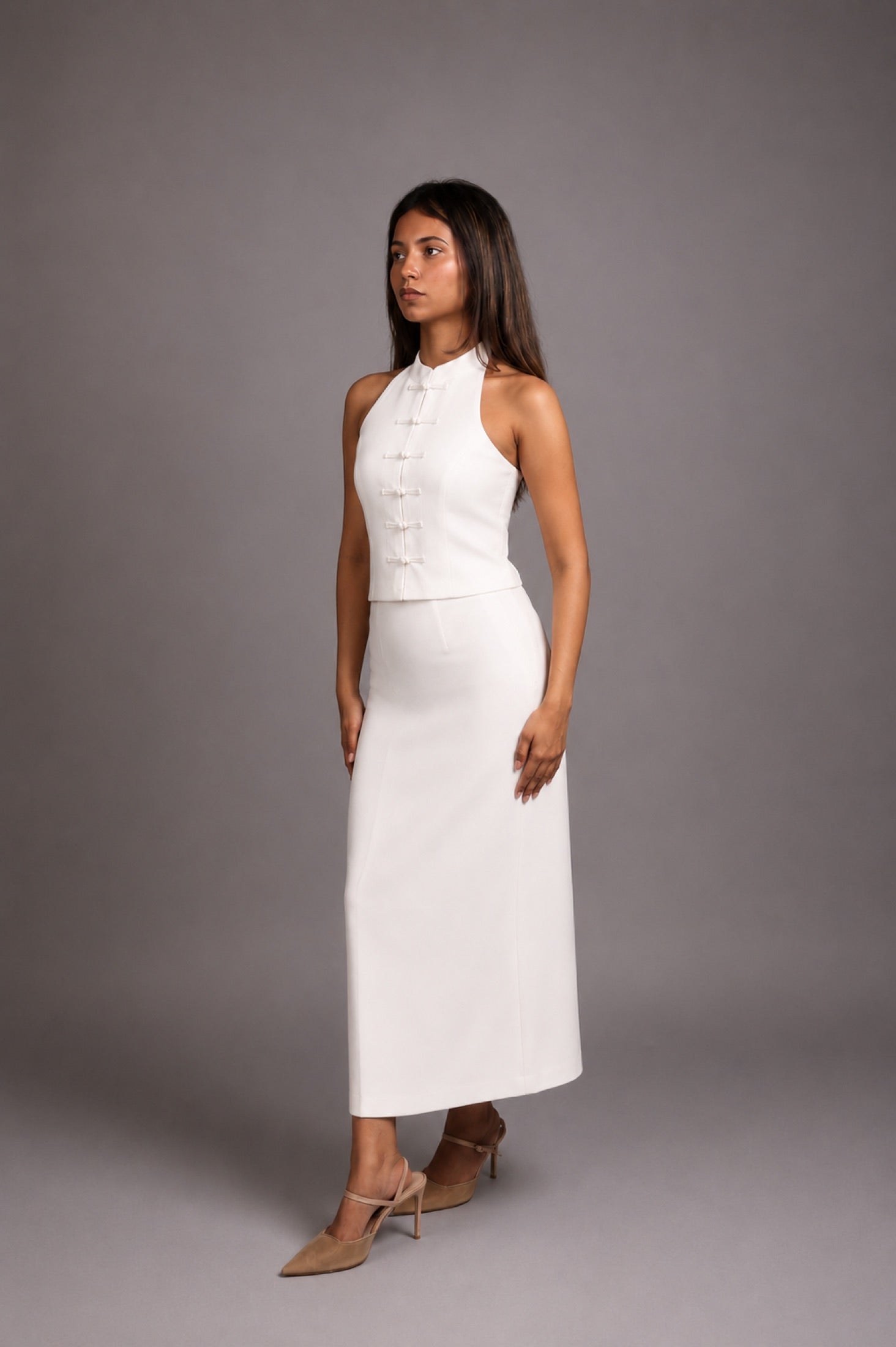 Model wearing the SEANT 003 mandarin halter top in ivory